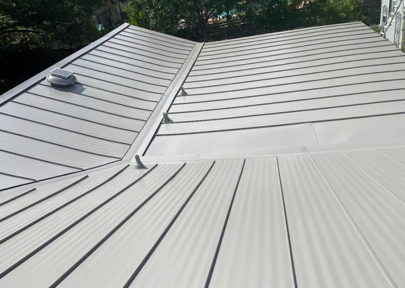 Solar attic fan installed on a metal roof for Roof Ventilation in Lake Wisconsin